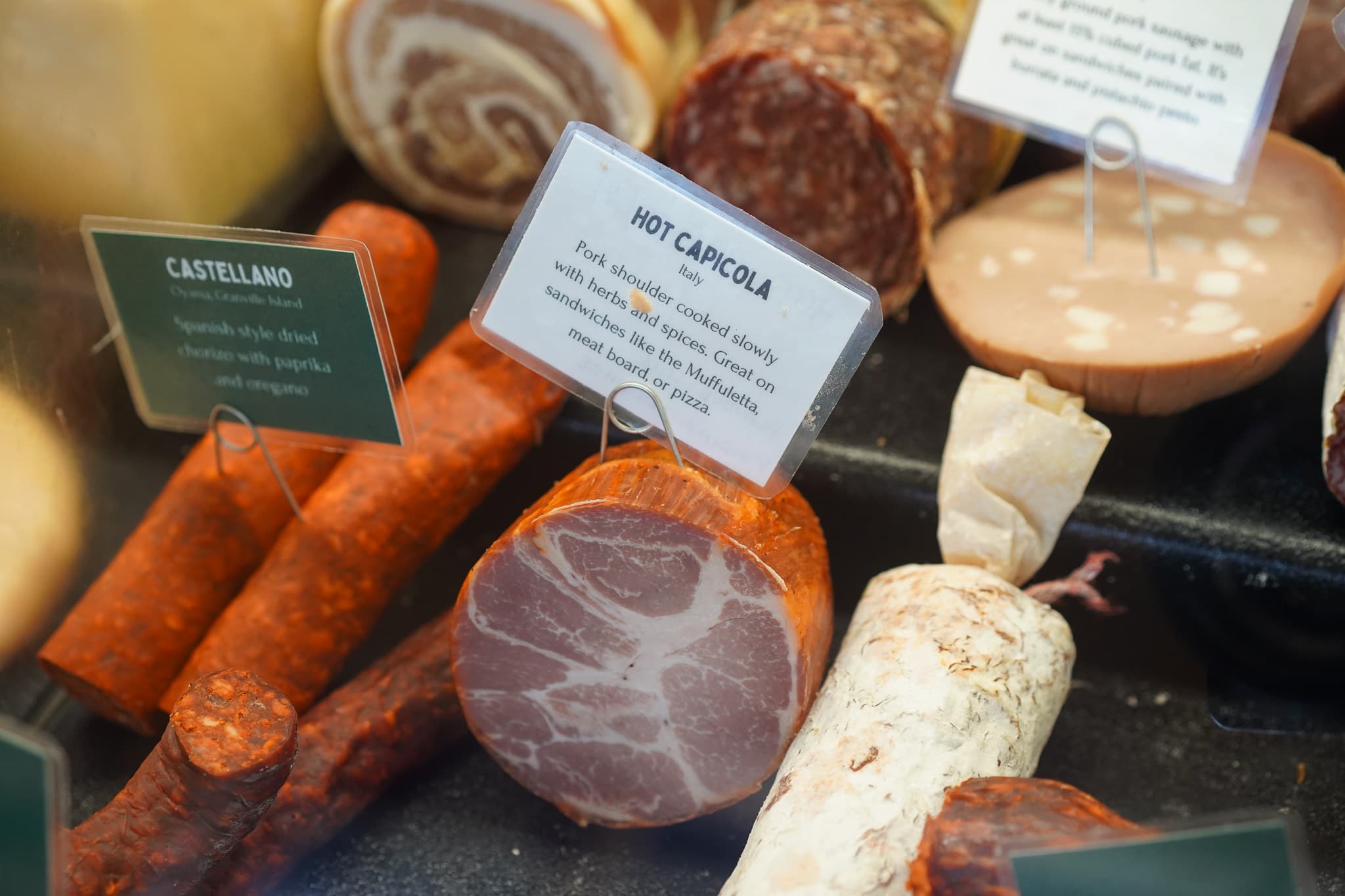 Hot capicolla hanging in the deli window
